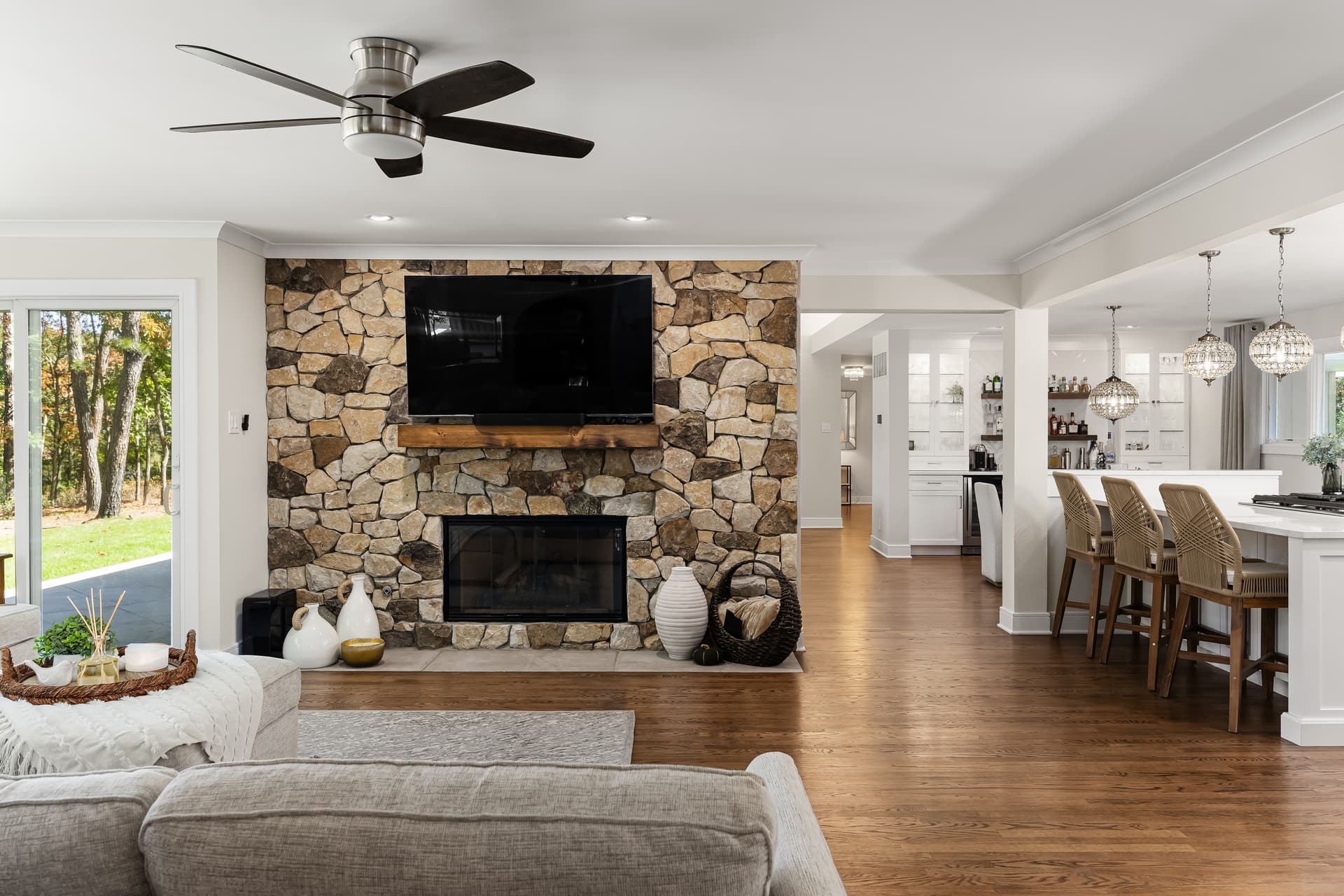 Living room with a stone fireplace