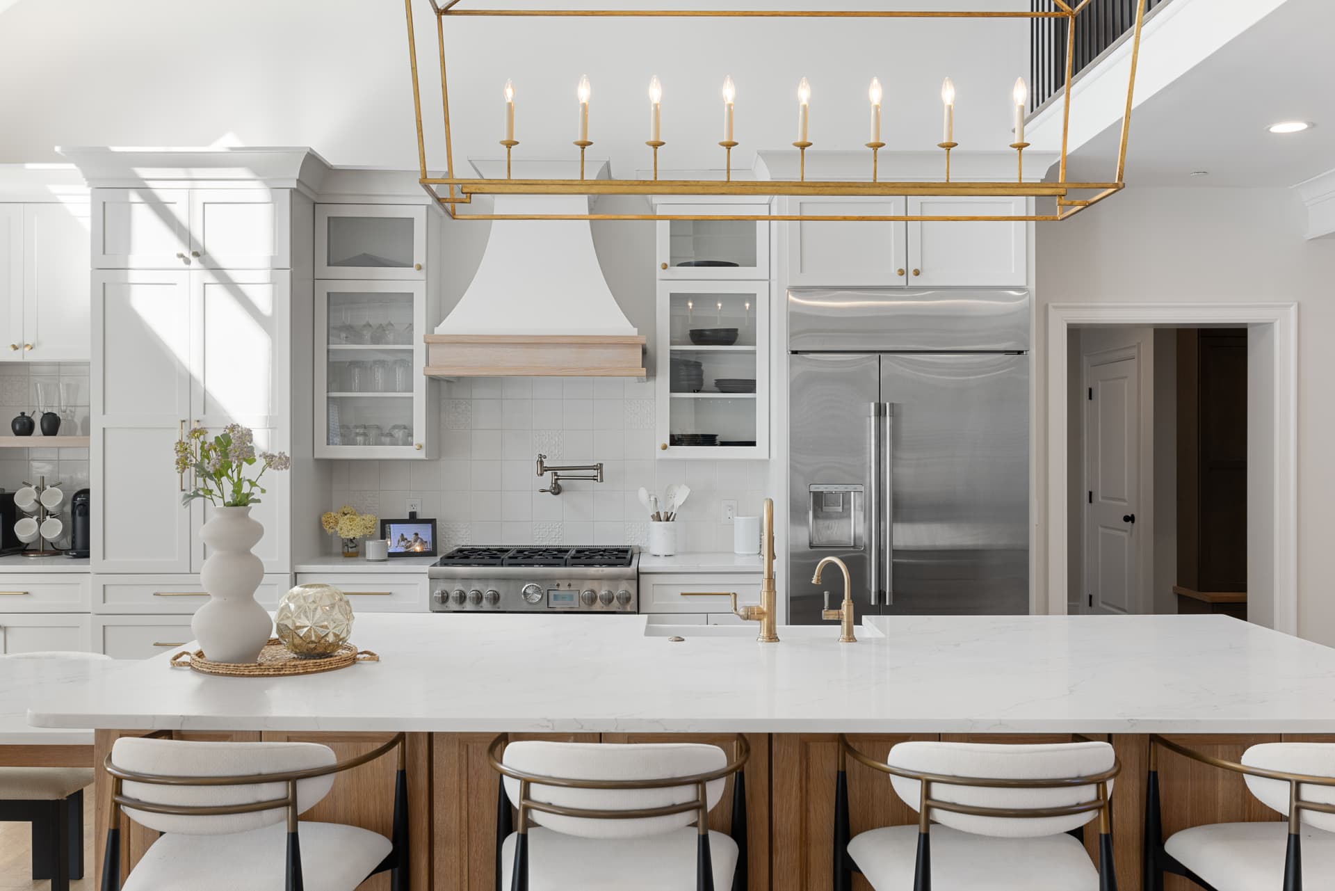 White kitchen with a custom hood