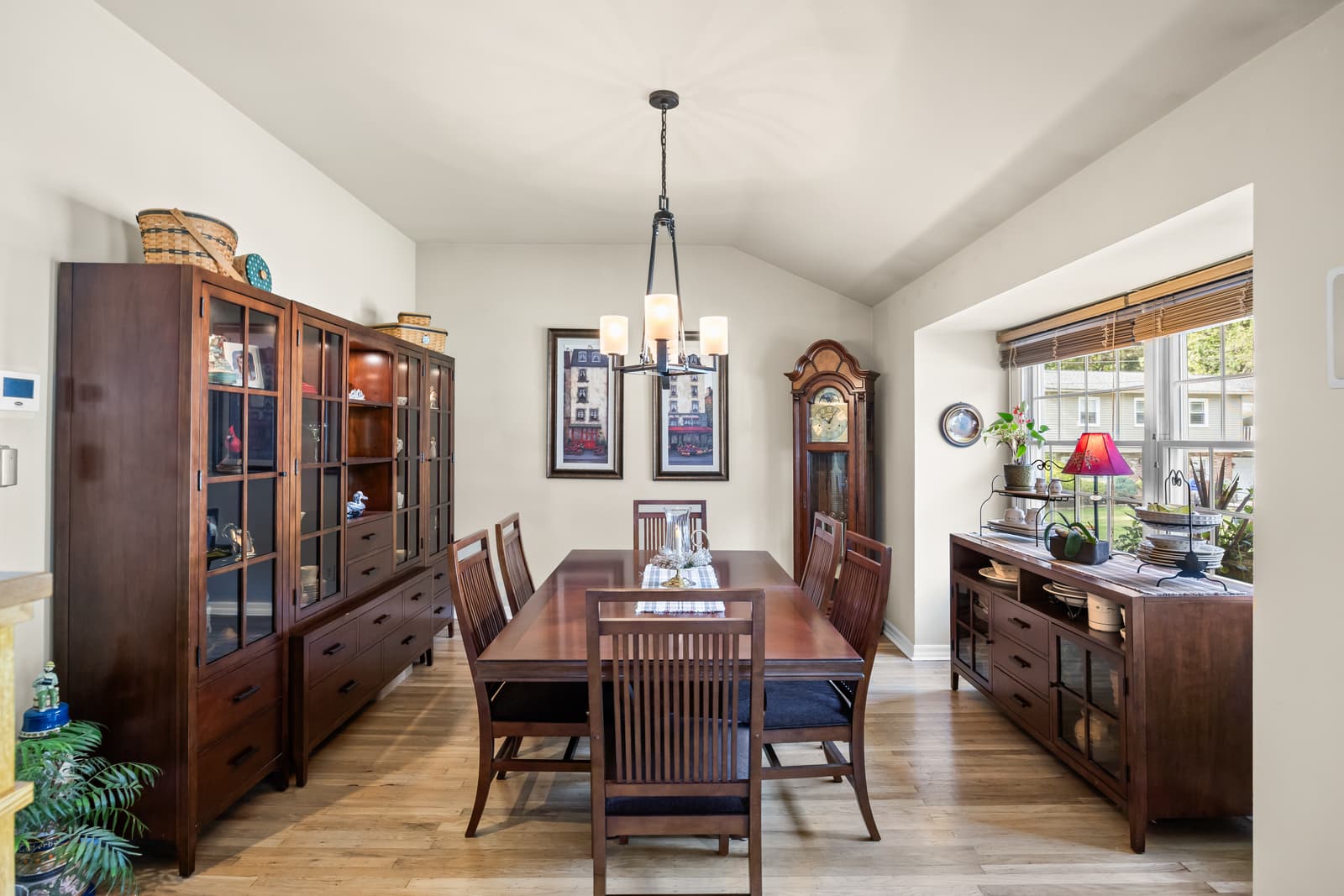 Formal dining room with a china hutch and grandfather clock in Cherry Hill, NJ
