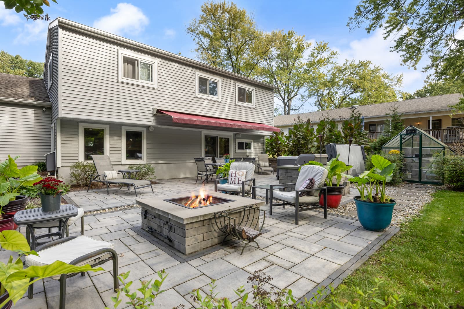 Backyard patio with a fire pit and lounge seating in Cherry Hill, NJ