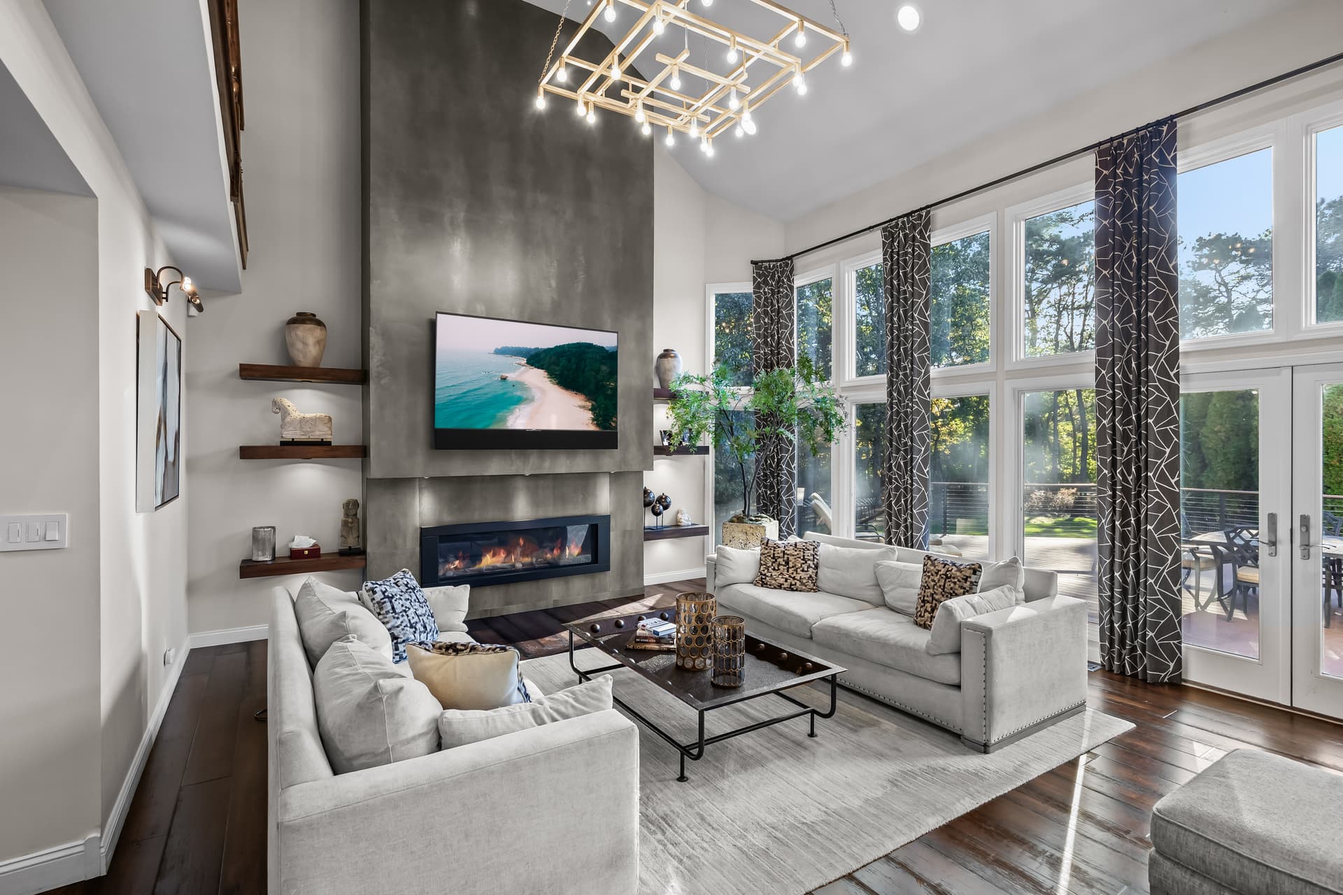 Contemporary great room with a linear fireplace and a wall of windows in Marlton, NJ