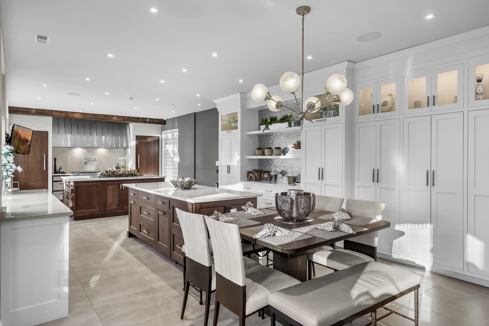 Gourmet white kitchen with a dark island open to the dining area in Marlton, NJ