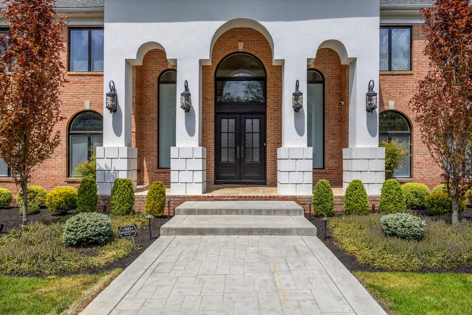 Brick home with an arched portico front entrance, Medford NJ real estate photography