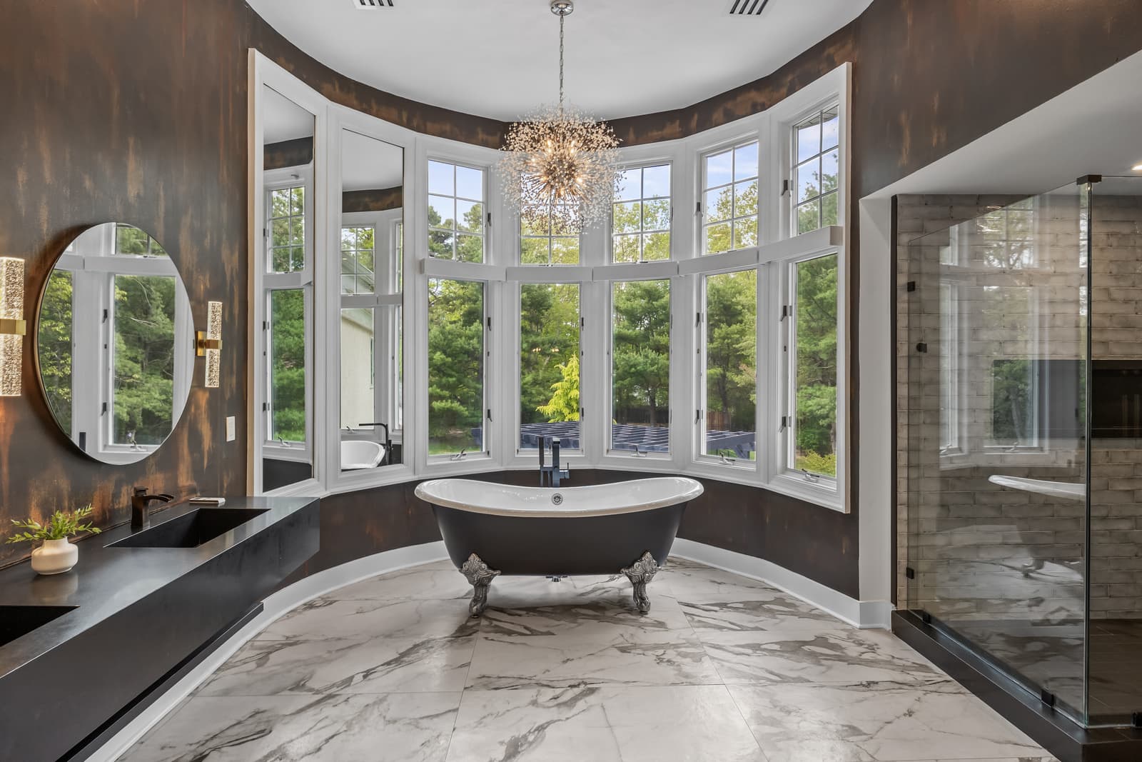 Spa bathroom with a freestanding tub framed by bay windows in Medford, NJ