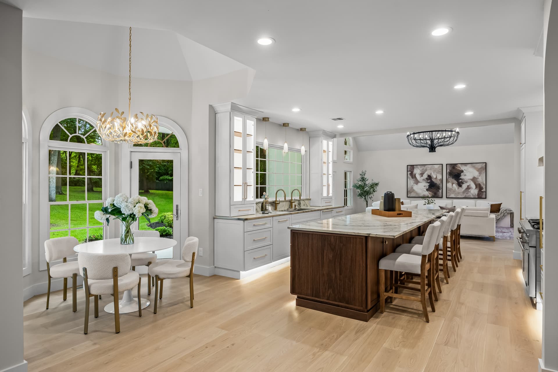 Open kitchen and breakfast area with arched windows in a Moorestown home