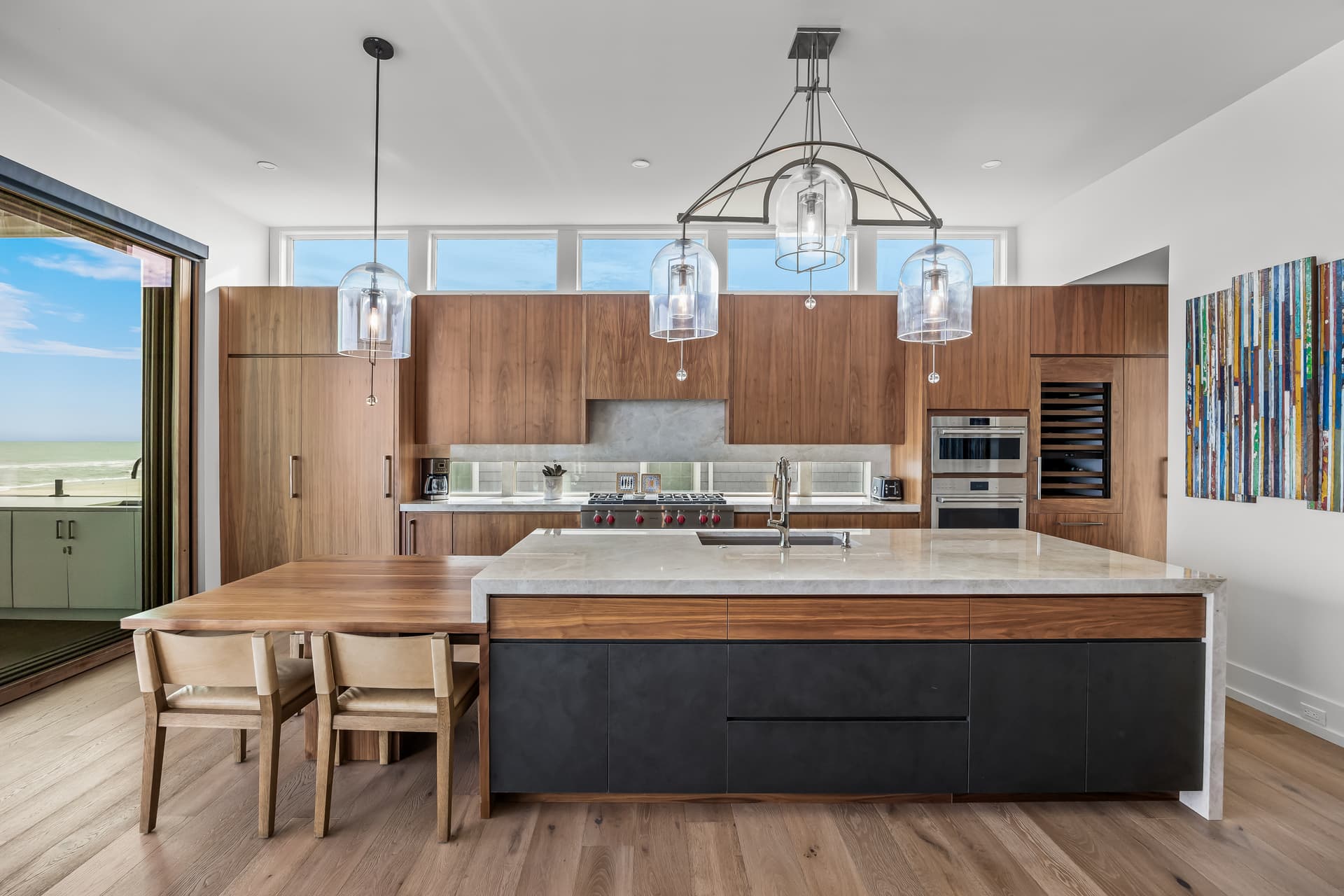 Modern kitchen with a marble waterfall island and ocean view, South Jersey